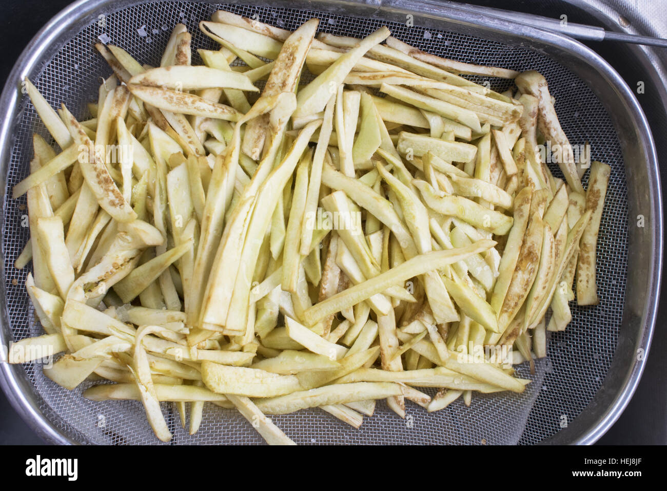 https://c8.alamy.com/comp/HEJ8JF/raw-handmade-potatoes-cut-in-sticks-ready-to-be-fried-HEJ8JF.jpg