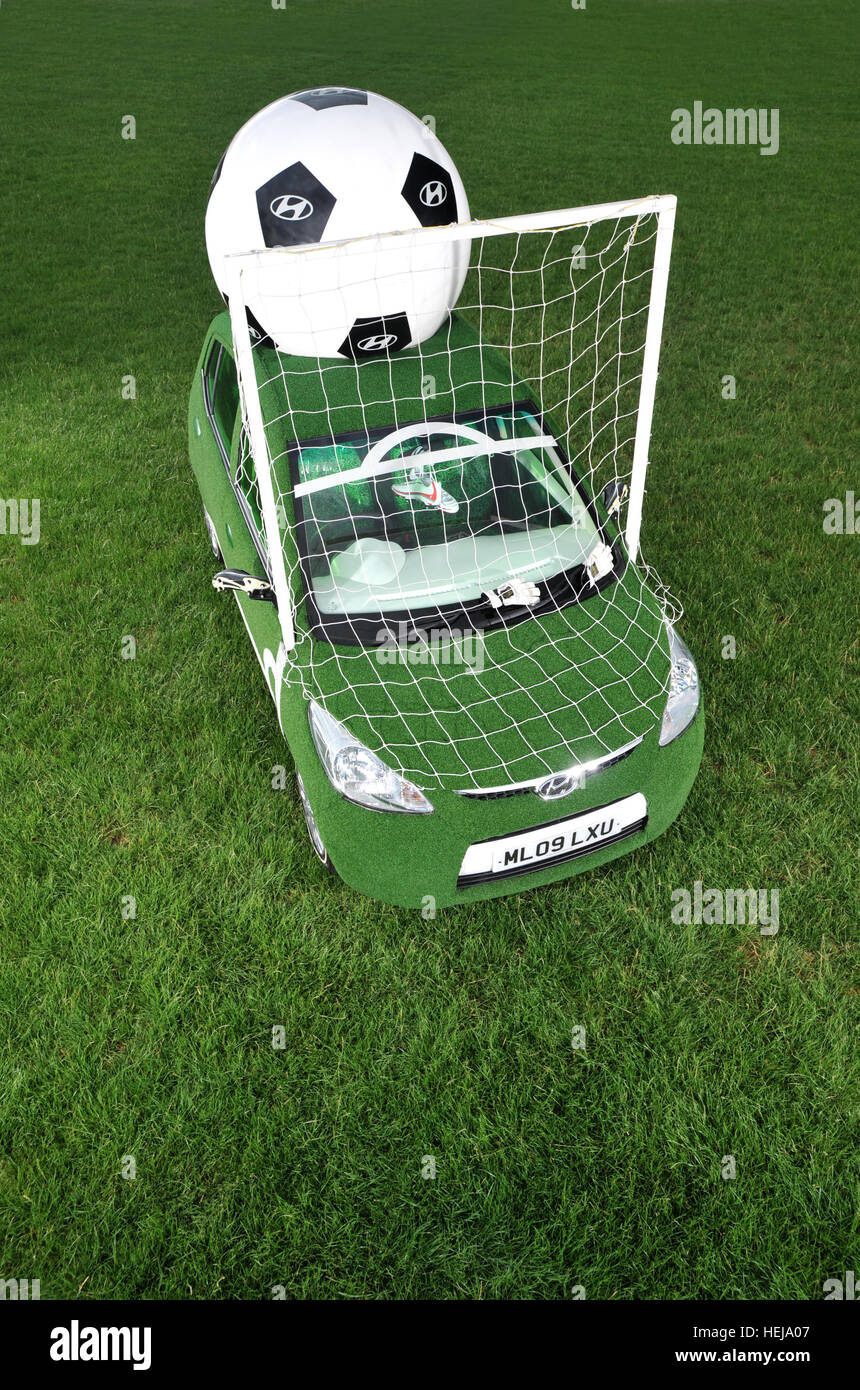 2009 Hyundai i10 promotional football car with grass bodywork, goalposts and giant ball Stock Photo