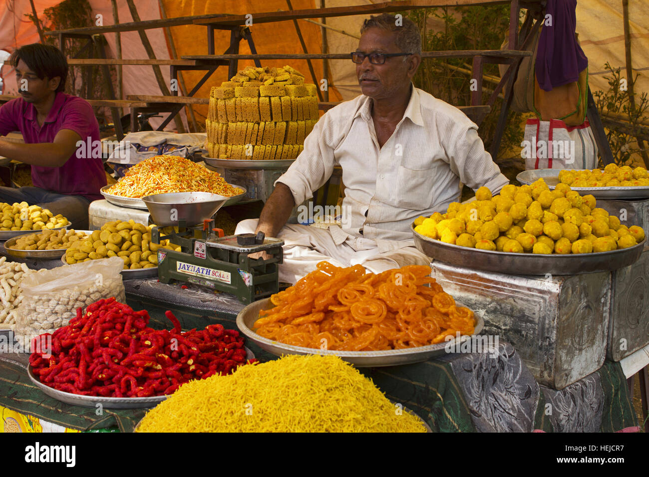 Vendor selling Indian sweets, Pune, Maharashtra India Stock Photo