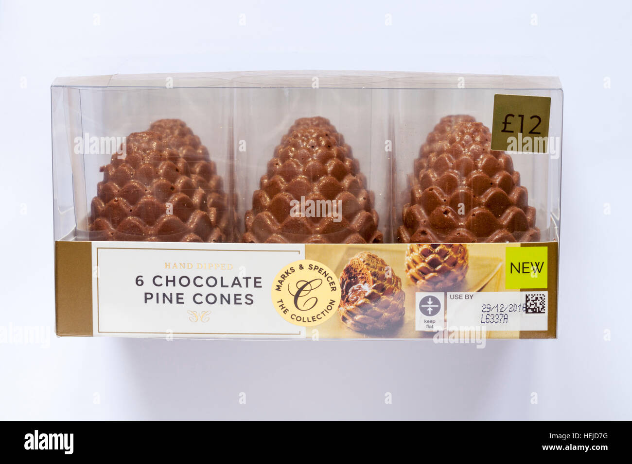 Pack of Marks & Spencer The Collection - hand dipped 6 chocolate pine cones isolated on white background Stock Photo