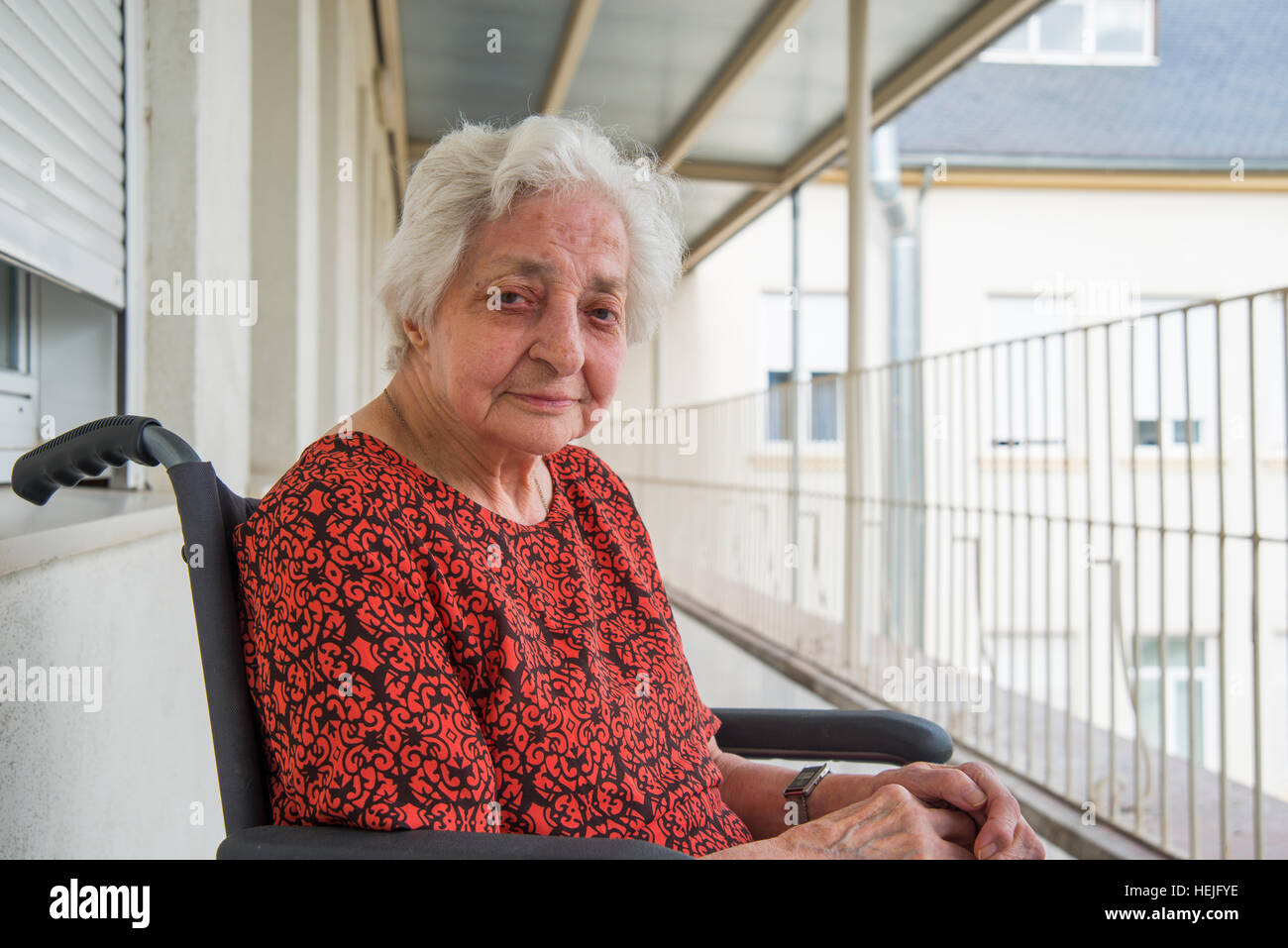 Portrait of elderly woman in a nursing home, smiling and looking at the camera. Stock Photo