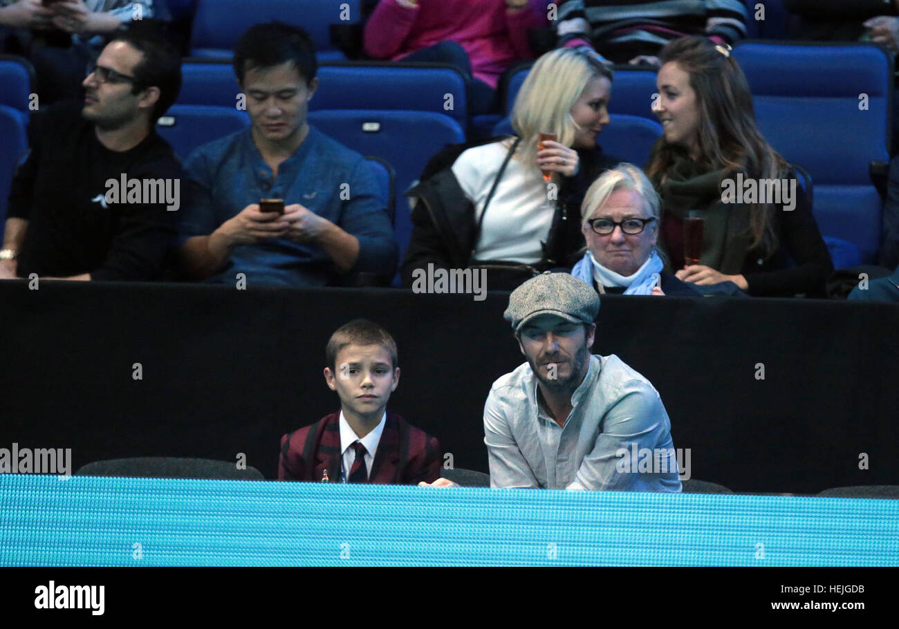 David Beckham and son Romeo watch the men's singles match between Milos Raonic of Canada and Dominic Thiem of Austria on day five of the ATP World Tour Finals at O2 Arena in London.  Featuring: David Beckham, Romeo Beckham Where: London, United Kingdom Wh Stock Photo