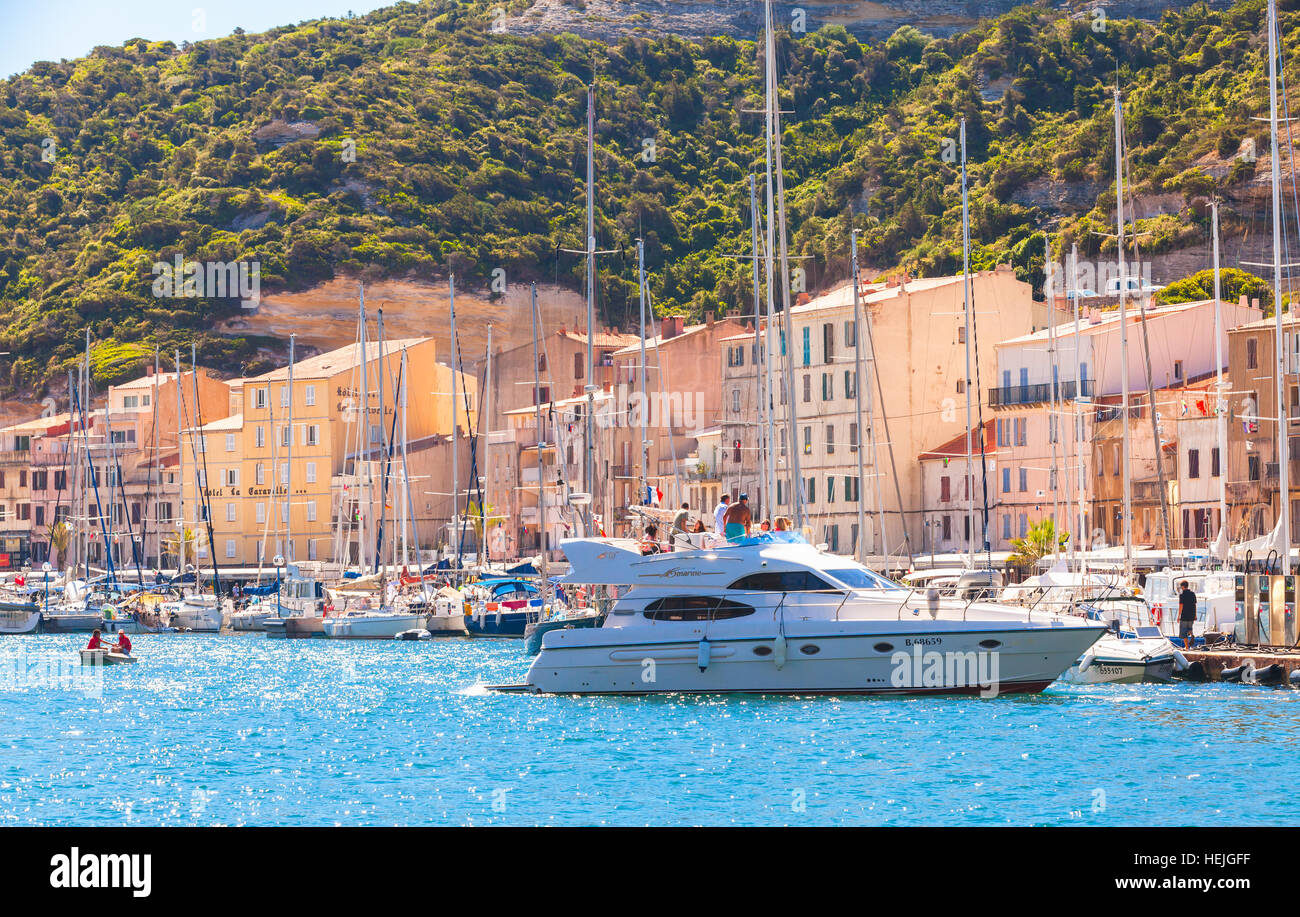 Bonifacio, France - July 2, 2015: Sailing yachts with ordinary people. Marina of Bonifacio, small resort port city of Corsica island in sunny summer d Stock Photo