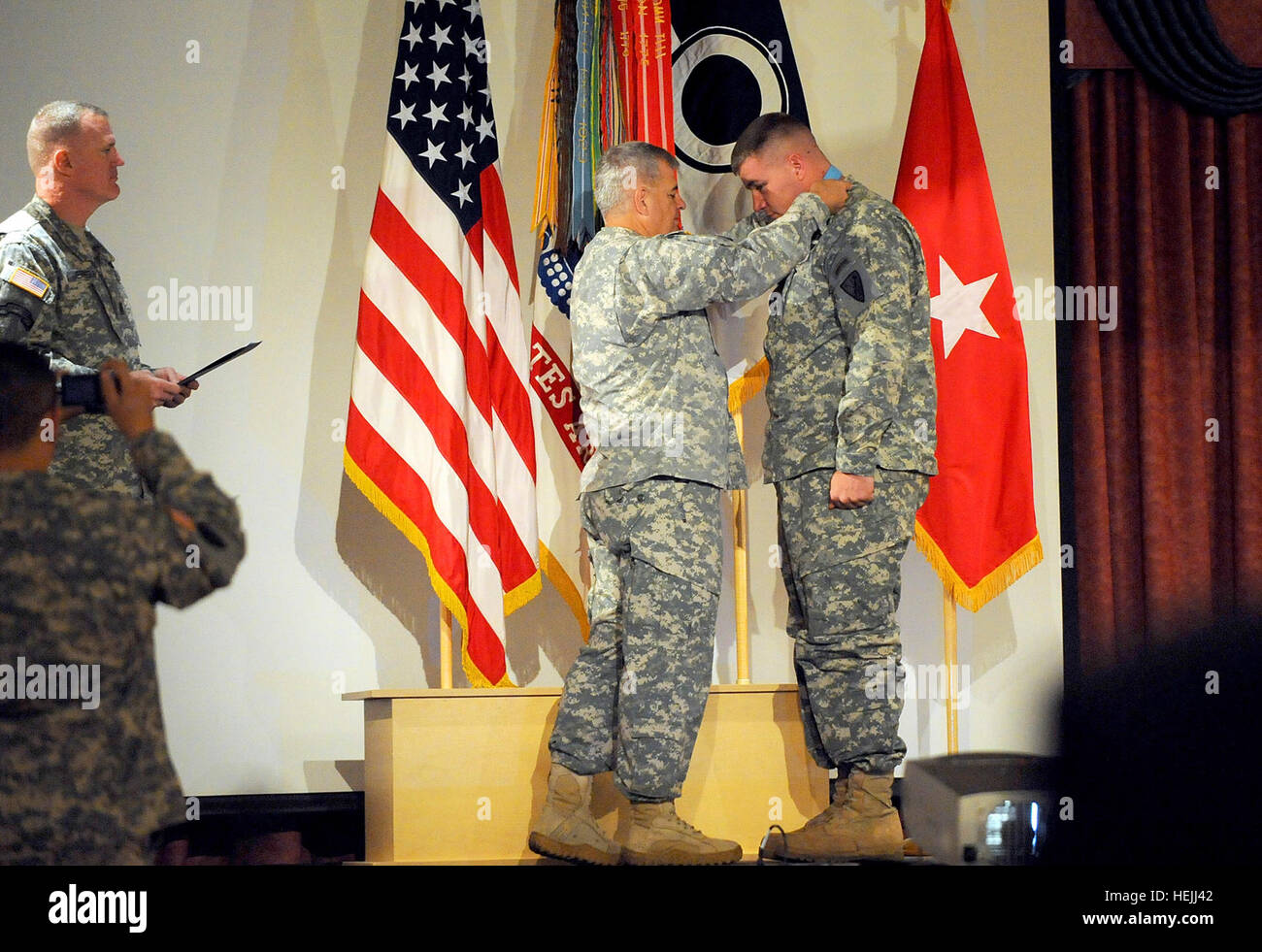 Brig. Gen. Jeff Mathis, left, places the Sgt. Audie Murphy Award on Sgt ...