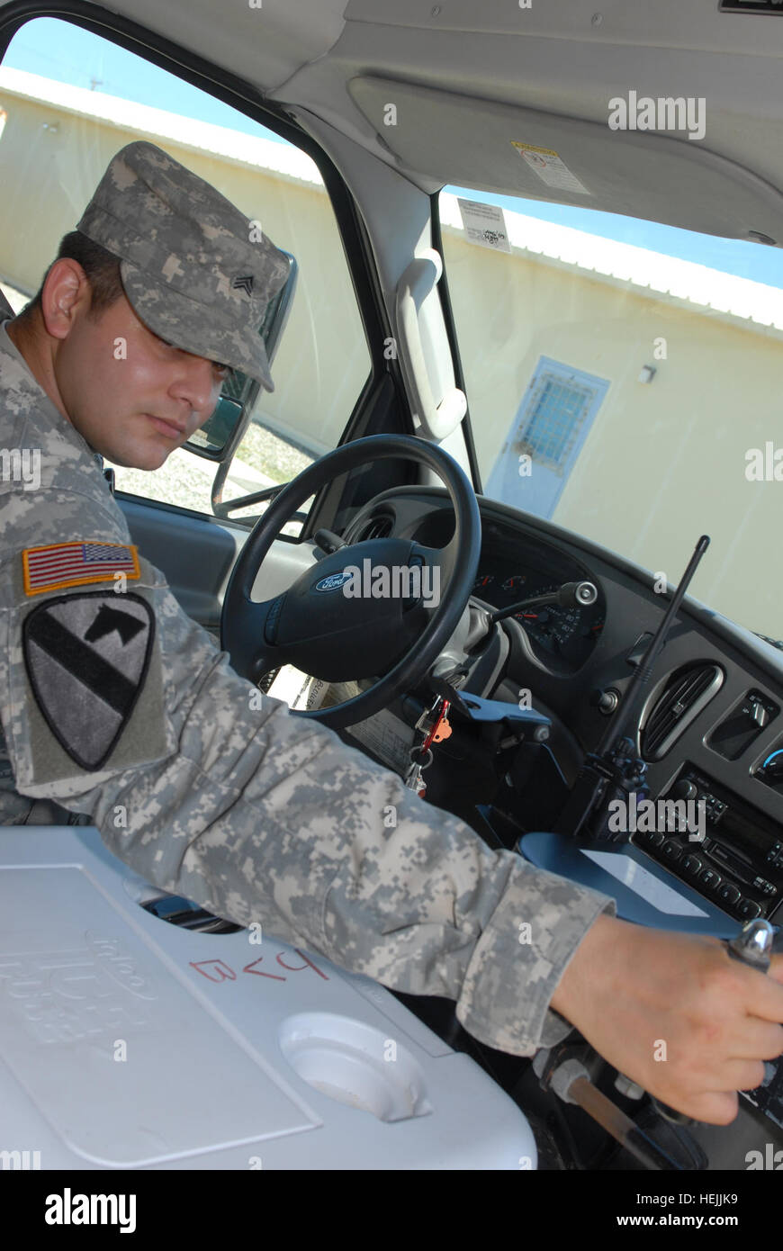 Army Sgt. Ricardo Gonzalez, a driver for the Joint Task Force Guantanamo's Joint Visitors' Bureau, drops off members of a tour group, Sept. 28. The JVB provides transportation at JTF facilities to media and other distinguished visitors as part of its ongoing mission to provide transparent care and custody of detainee operations. JTF Guantanamo conducts safe, humane, legal and transparent care and custody of detainees, including those convicted by military commission and those ordered released by a court. The JTF conducts intelligence collection, analysis and dissemination for the protection of Stock Photo