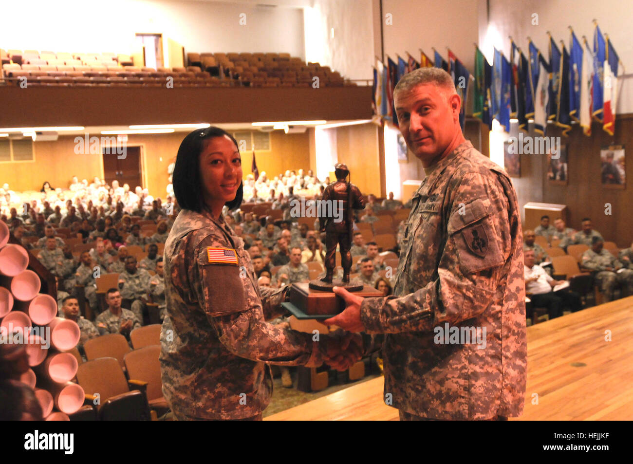 Command Sgt. Maj. Raymond Chandler awards Spc. Angel Wood, of the 11th ...