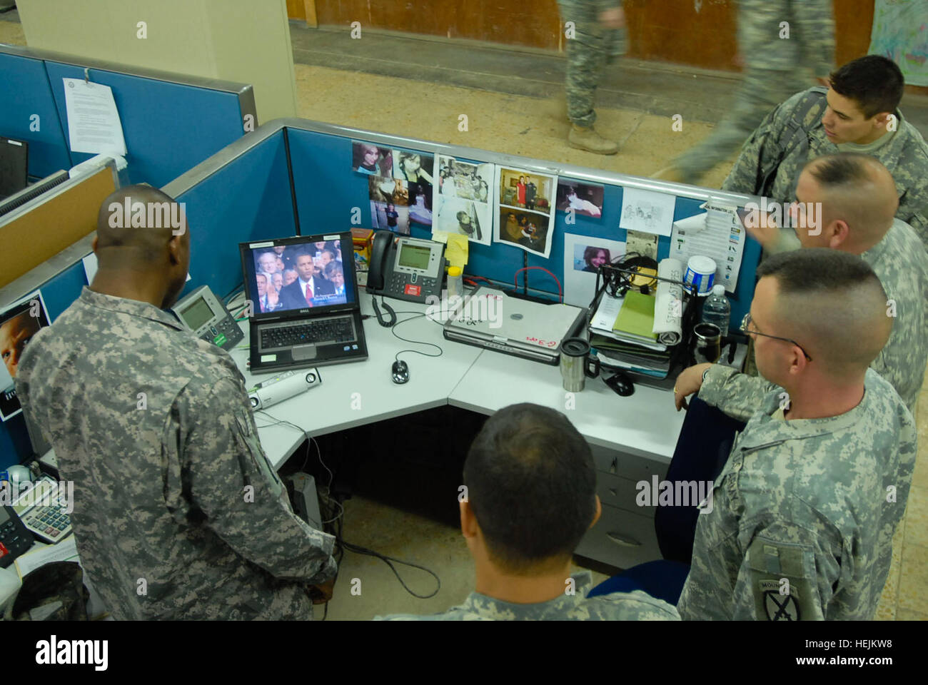 Soldiers from the 10th Mountain Division watch the presidential inauguration of Barack Obama broadcasted on their computer screen in Camp Victory, Iraq, Jan. 20. Soldiers inaugurate a new era from Iraq's soil 145855 Stock Photo