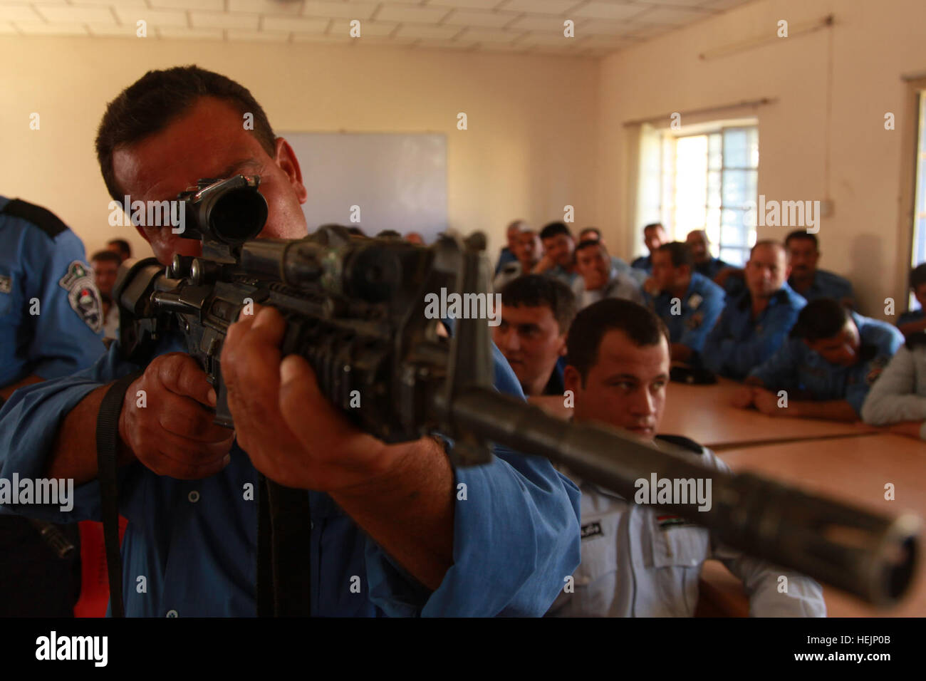 U.S. Soldiers assigned to Echo Company, 1st Battalion, 8th Cavalry, 2nd Brigade Combat Team, 1st Cavalry Division, instruct Iraqi police during a mission to conduct U.S. weapons familiarization training in Altun Kupri, Iraq, Oct. 19. Weapon Familiarization 216884 Stock Photo