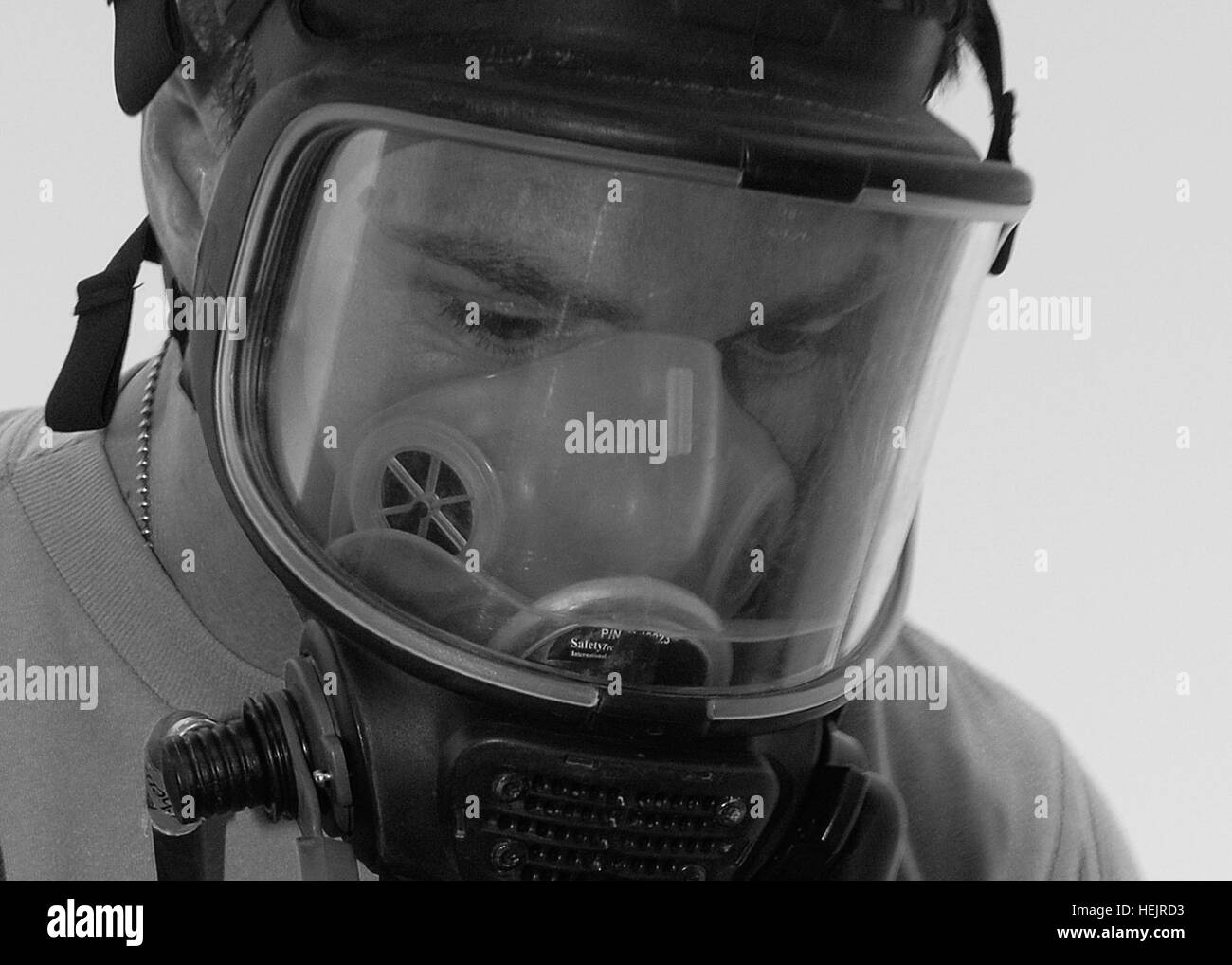 Chemical operations specialist Sgt. Robert Kibler peers through his gas