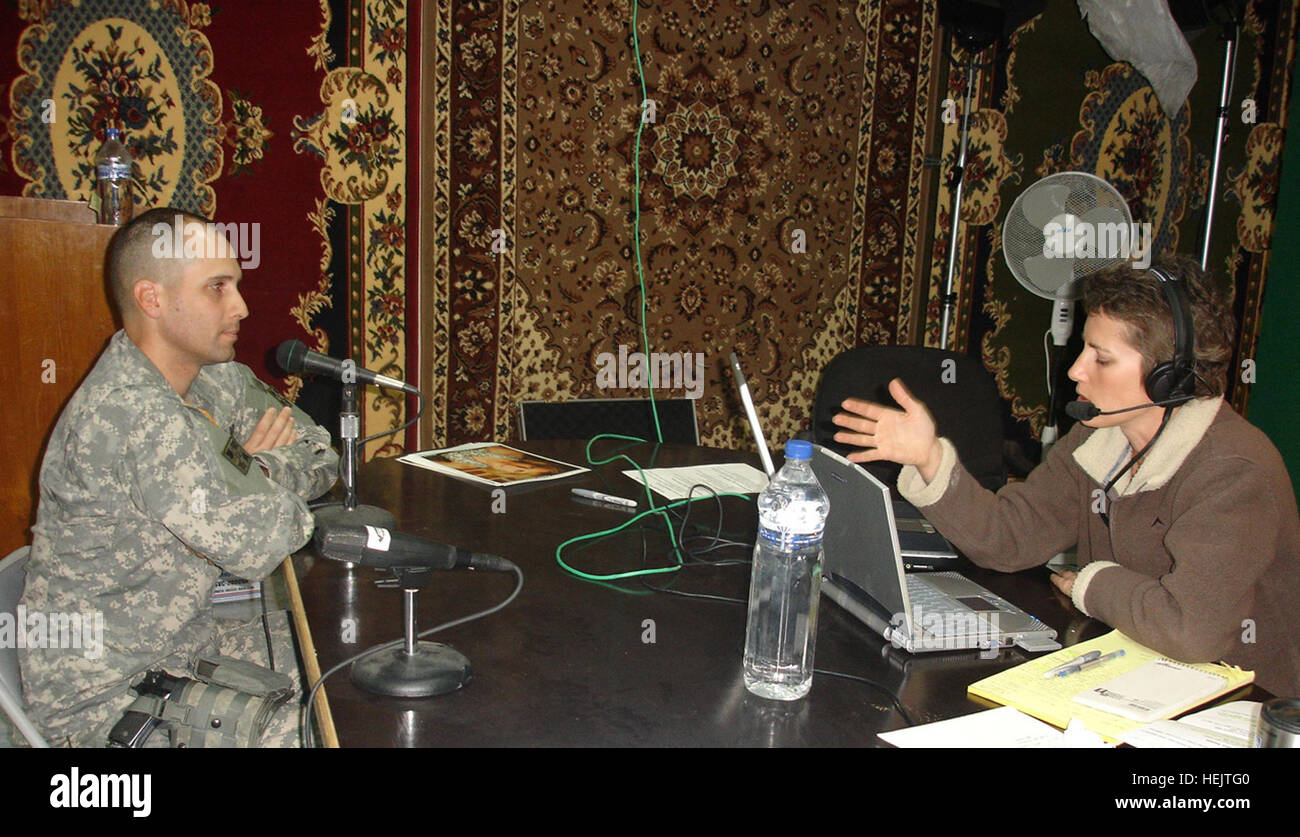 CAMP LIBERTY, Iraq-Maj. Bryan Gibby, intelligence officer, Fires Brigade, 4th Infantry Division, chats with talk show host Laura Ingraham during a live broadcast of the Laura Ingraham Show at Camp Liberty, Iraq, Feb. 10. (U.S. Army Photo by Sgt. 1st Class Jerry Malec, Fires Bde. PAO, 4th Inf. Div) Laura Ingraham Iraq 2 Stock Photo