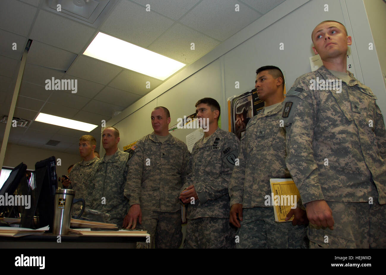 Soldiers from the 384th Military Police Company, headquartered in Bloomington, Ind., are waiting to get their hearing tested at the Soldier Readiness Center at Camp Atterbury Joint Maneuver Training Center before they can move to the next station in the demobilization process Tuesday, Dec. 22. The 384th MP Company made it home from their year-long deployment in Iraq just in time for Christmas. Home for the holidays, Despite bad weather and limited travel Soldiers make it home for Christmas 234513 Stock Photo