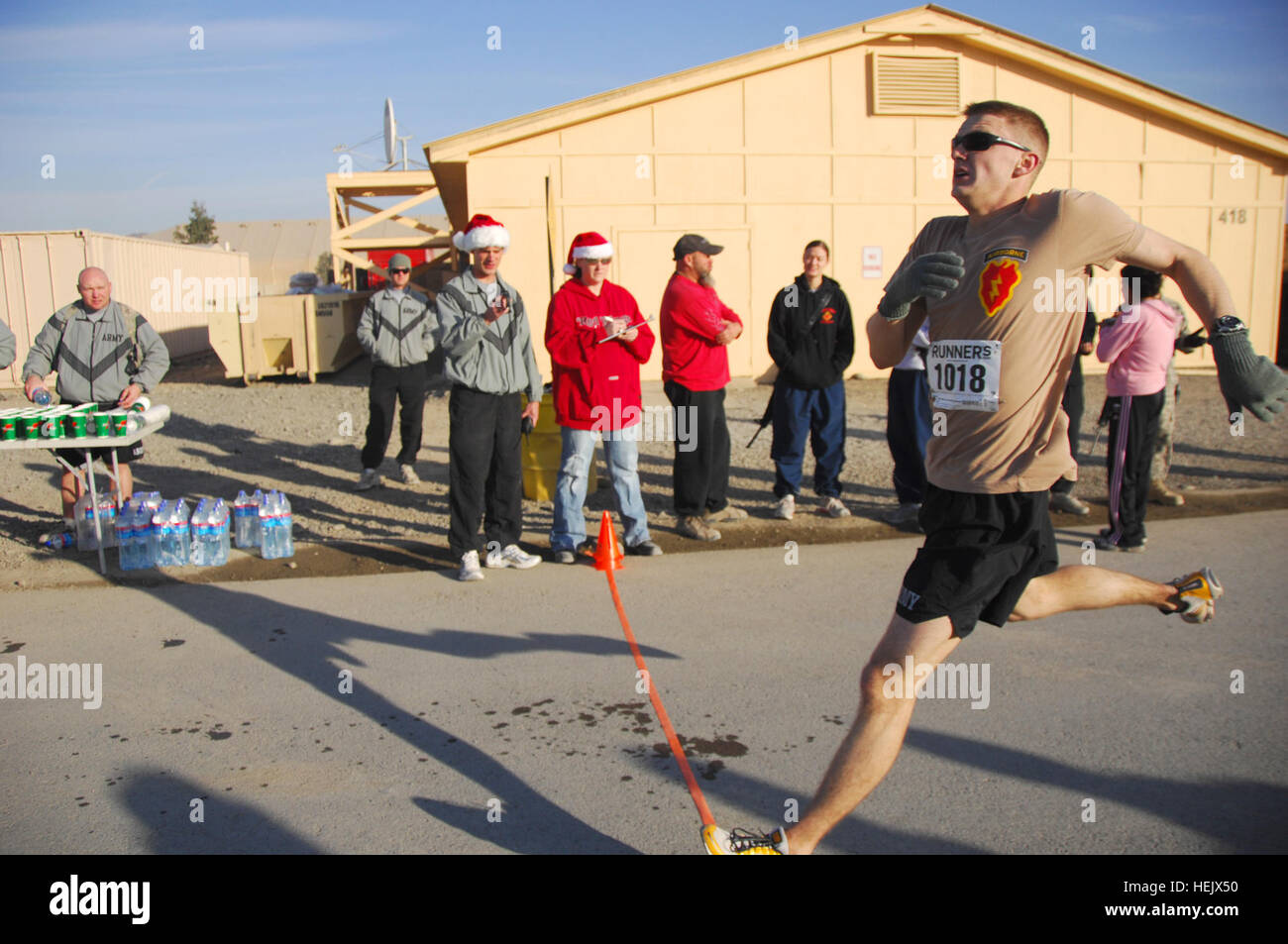 U.S. Army soldier competes in the 4.25 holdiay run, Forward Operating Base Salerno, Khowst Province, Afghanistan, Dec. 25. The first place winner of the race with a finishing time of 26:07 was U.S. Marine Corps Maj. Jeff O' Donnel. 4.25 Holiday Run 234835 Stock Photo