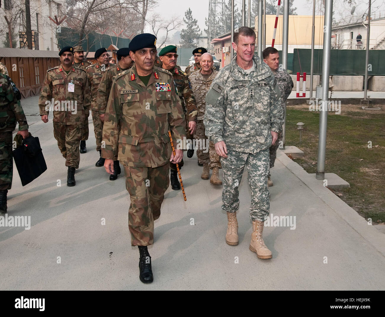 Gen. Ashfaq Parvez Kayani, Chief of Army Staff of the Pakistan Army and Gen. Stanley A. McChrystal, Commander of NATO International Security Assistance Force and U.S. Forces Afghanistan lead participants towards the conference area to meet for the 29th Tripartite Commission meeting.  The Tripartite Commission, comprised of senior military and diplomatic representatives from Afghanistan, Pakistan and the United States. Photo by U.S. Army Sgt. David E. Alvarado. (RELEASED) US-Afghan-Pakistani military men Stock Photo