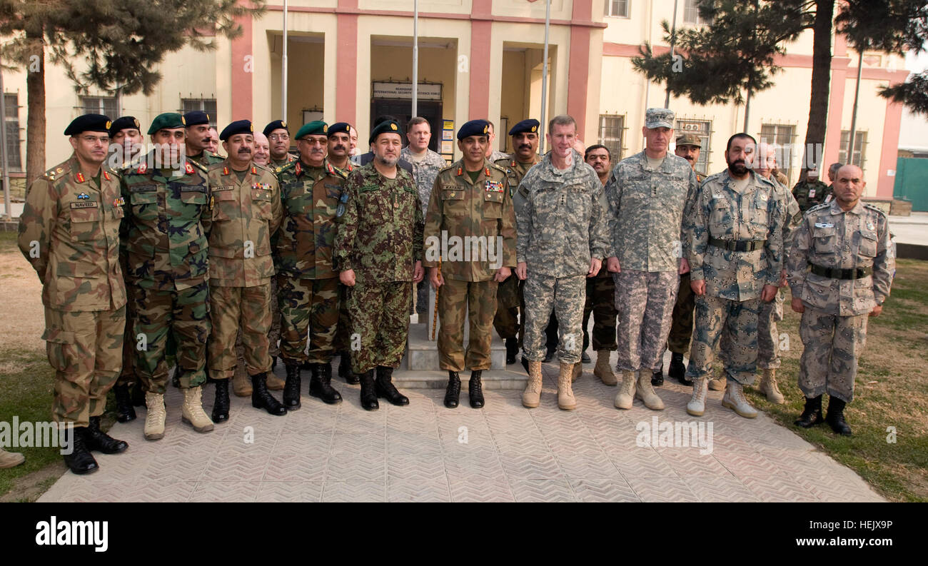 Gen. Bismullah Mohammadi of the Afghan National Army, Gen. Ashfaq Parvez Kayani Chief of Army Staff of the Pakistan Army and Gen. Stanley A. McChrystal, Commander of NATO International Security Assistance Force and U.S. Forces Afghanistan (Center) gather for a group photo with senior military and diplomatic representatives from Afghanistan, Pakistan and the United States prior to the 29th Tripartite Commission held at NATO International Security Assistance Forces Headquarters, Kabul, Afghanistan. Photo by U.S. Army Sgt. David E. Alvarado. (RELEASED) Afghan-Pakistani-NATO Stock Photo