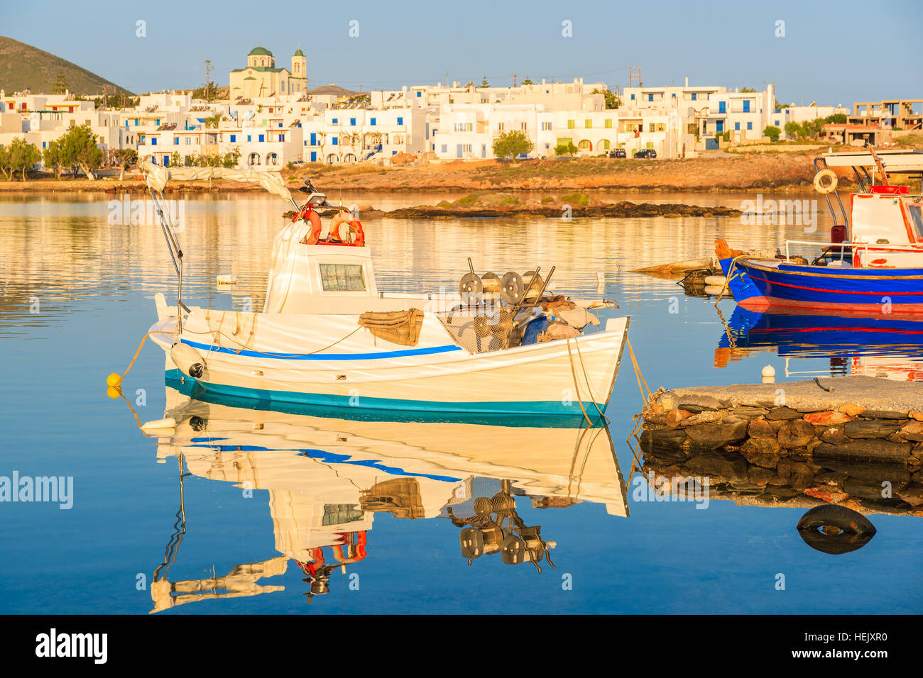 Fishing boat in Naoussa port at sunrise time, Paros island, Cyclades, Greece Stock Photo