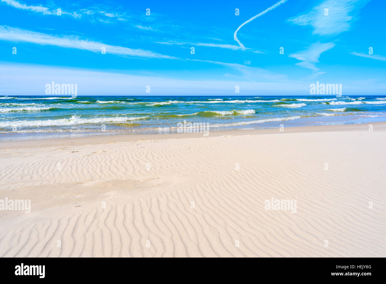 Sea waves of Baltic Sea on a sandy beach in Bialogora, Poland Stock Photo