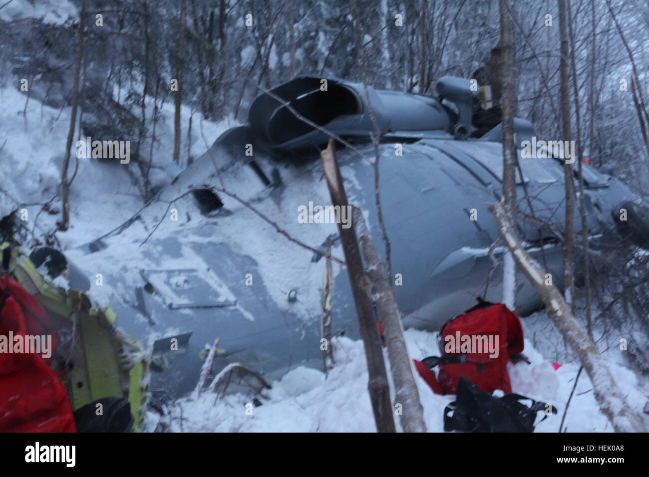 Wreckage from anMH60S Knighthawk helicopter is photographed at a