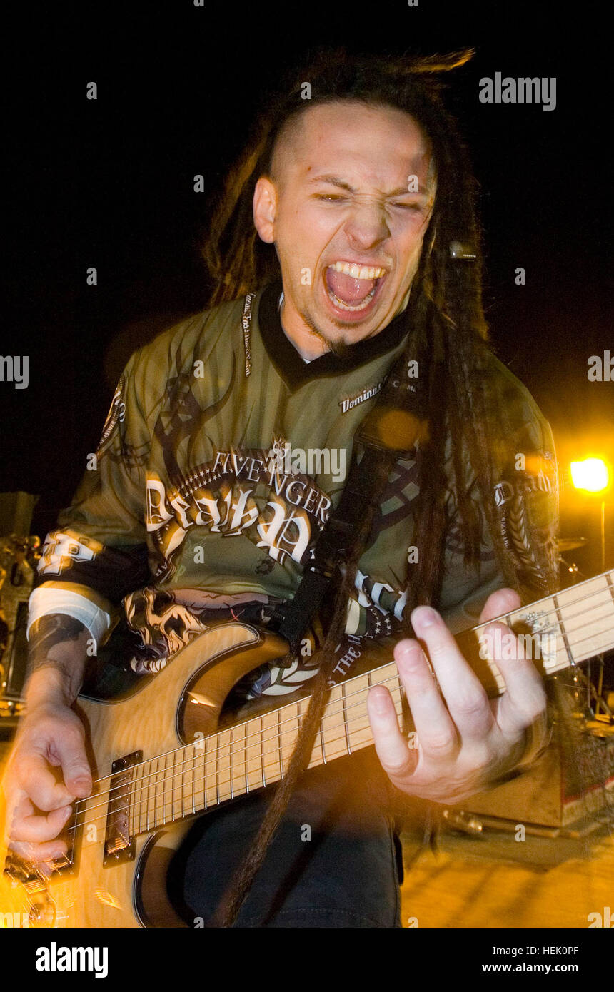 Guitarist Zoltan Bathory plays with his metal band Five Finger Death Punch  as they perform for U.S. troops at Camp Stryker, Baghdad, March 3. The band  came to Iraq to play a