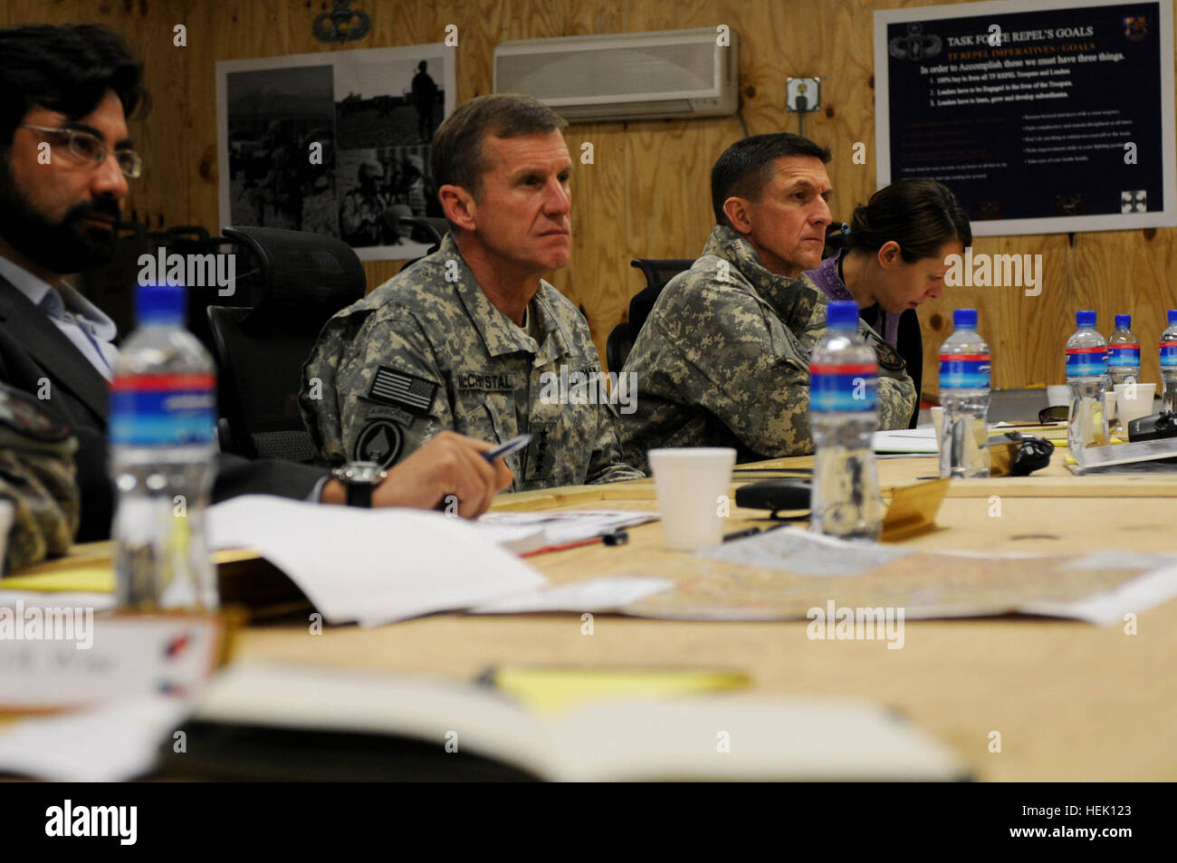 100310-A-0884S-001: LOGAR PROVINCE, Afghanistan – U.S. Army Gen. Stanley McChrystal, commander of International Security Assistance Force, with U.S. Army Maj. Gen. Michael T. Flynn, chief of intelligence for ISAF, listen to a briefing by 173rd Airborne Brigade Combat Team commander, U.S. Army Col. James Johnson, during a visit to Forward Operating Base Shank, March 10.  McChrystal also spoke during the meeting, discussing current operations and the future of the counter-insurgency fight in Afghanistan.  “We’re herenot to fight the war, but we’re here to win,” said McChrystal.  “And we win thro Stock Photo