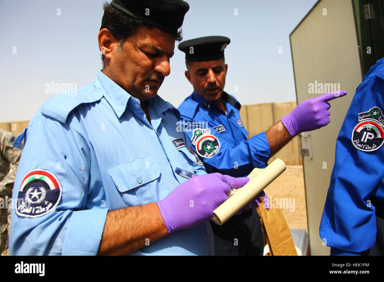 Iraqi policemen from the Basra Criminal Evidence Division complete the ...