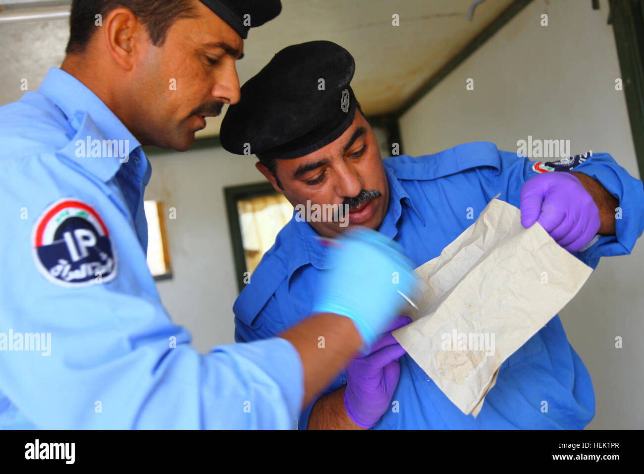 Iraqi police officers from the Basra Criminal Evidence Division ...