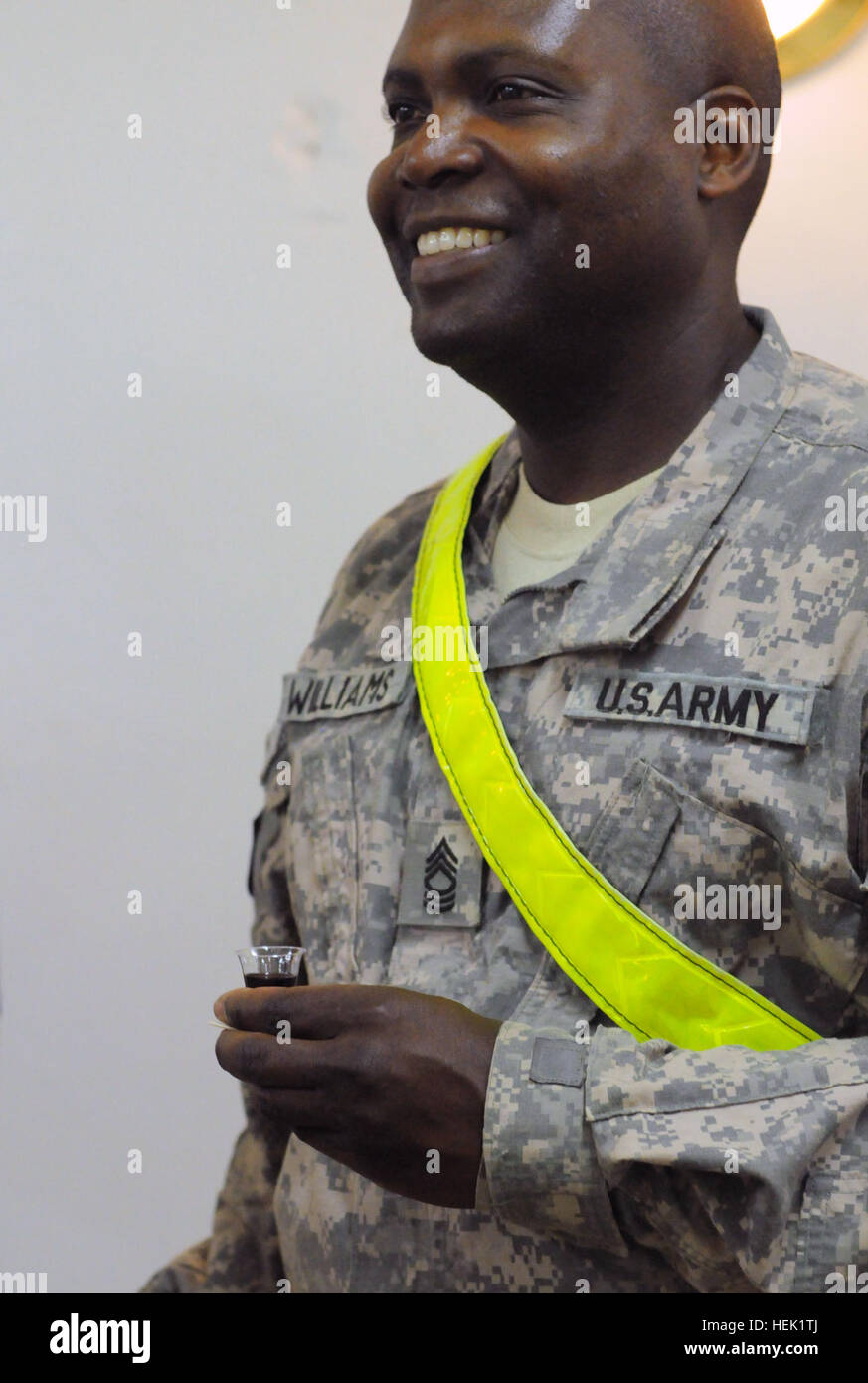 Master Sgt. Keith Williams, with the Provincial Police Transition Team, takes part in communion during Good Friday Service at Forward Operating Base Warhorse April 2. Williams collects his communion cups as a way to count down his time before redeploying. The gentle barbarian 272966 Stock Photo