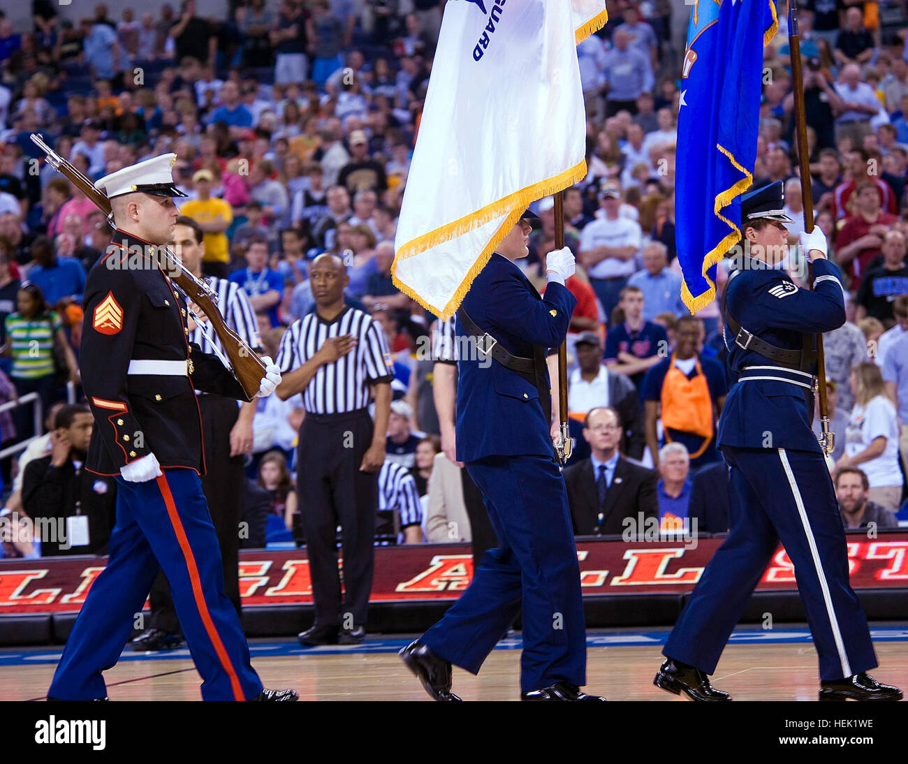 U.S. Armed Forces Color Guard march during the opening ceremony of the ...