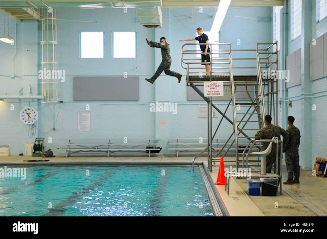 A U.S. Soldier jumps from the high dive during the combat water