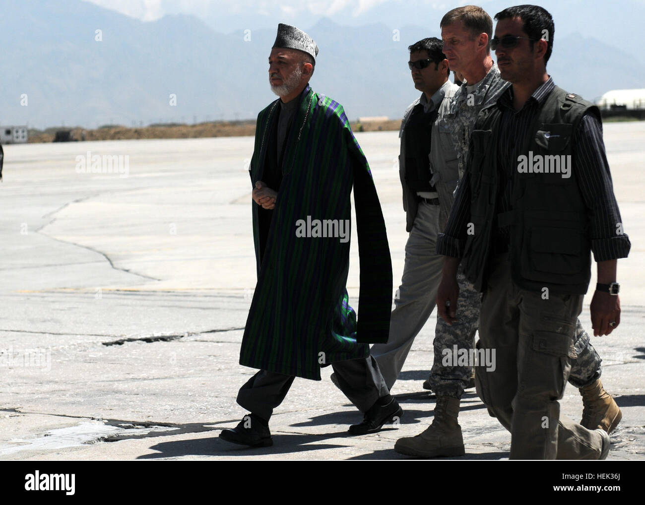 BAGRAM AIRFIELD, Afghanistan -- The President of Afghanistan Hamid Karzai and U.S. Army Gen. Stanley McCrystal, the commander of International Security Assistance Forces, arrive at Bagram Airfield, Afghanistan, May 8. Karzai visited Bagram just days before he's to travel to the United States to meet with the President of the United States Barack Obama. While Karzai was at BAF, he visited wounded Afghan and U.S. Soldiers at the Joint Craig Theater Hospital and also addressed Servicemembers who are stationed there. (Photo by U.S. Army Staff Sgt. Susan Wilt, Combined Joint Task Force-82 Public Af Stock Photo