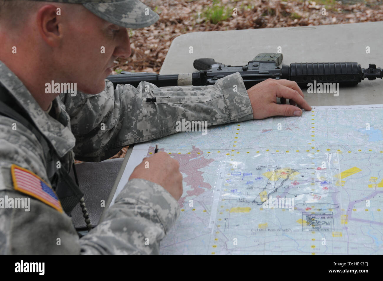 Specialist John Sanders, from Sandusky, Ohio, assigned to B Company, 1st Battalion, 1st Special Warfare Training Group (Airborne), identifies terrain features on a military map during the U.S. Army John F. Kennedy Special Warfare Center and School's Soldier and Noncommissioned Officer of the Year competition at Fort Bragg, N.C. May 18. Special Warfare Center Soldier of the Year 281306 Stock Photo