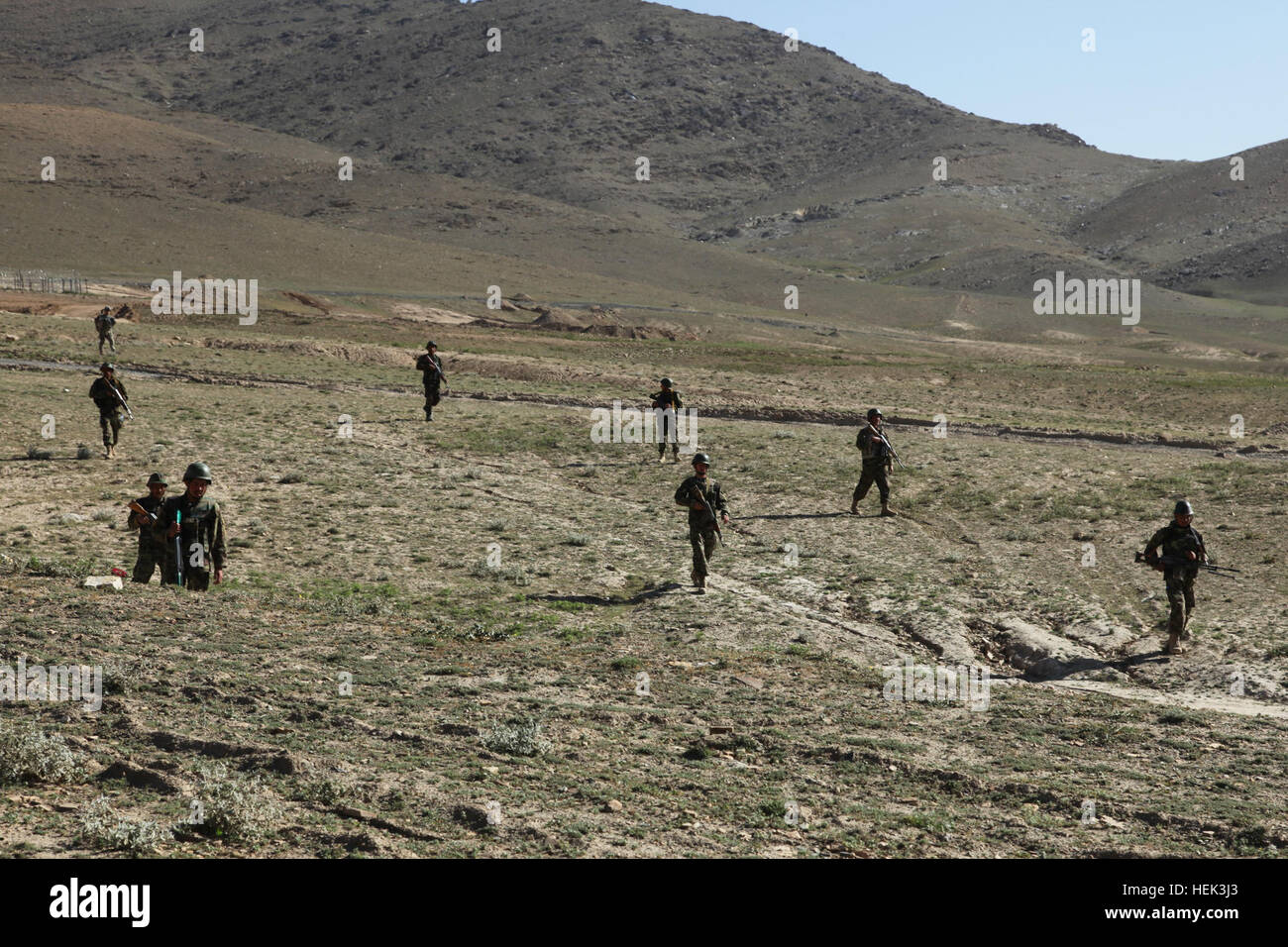 Afghan National Army soldiers conduct a dismounted movement into the