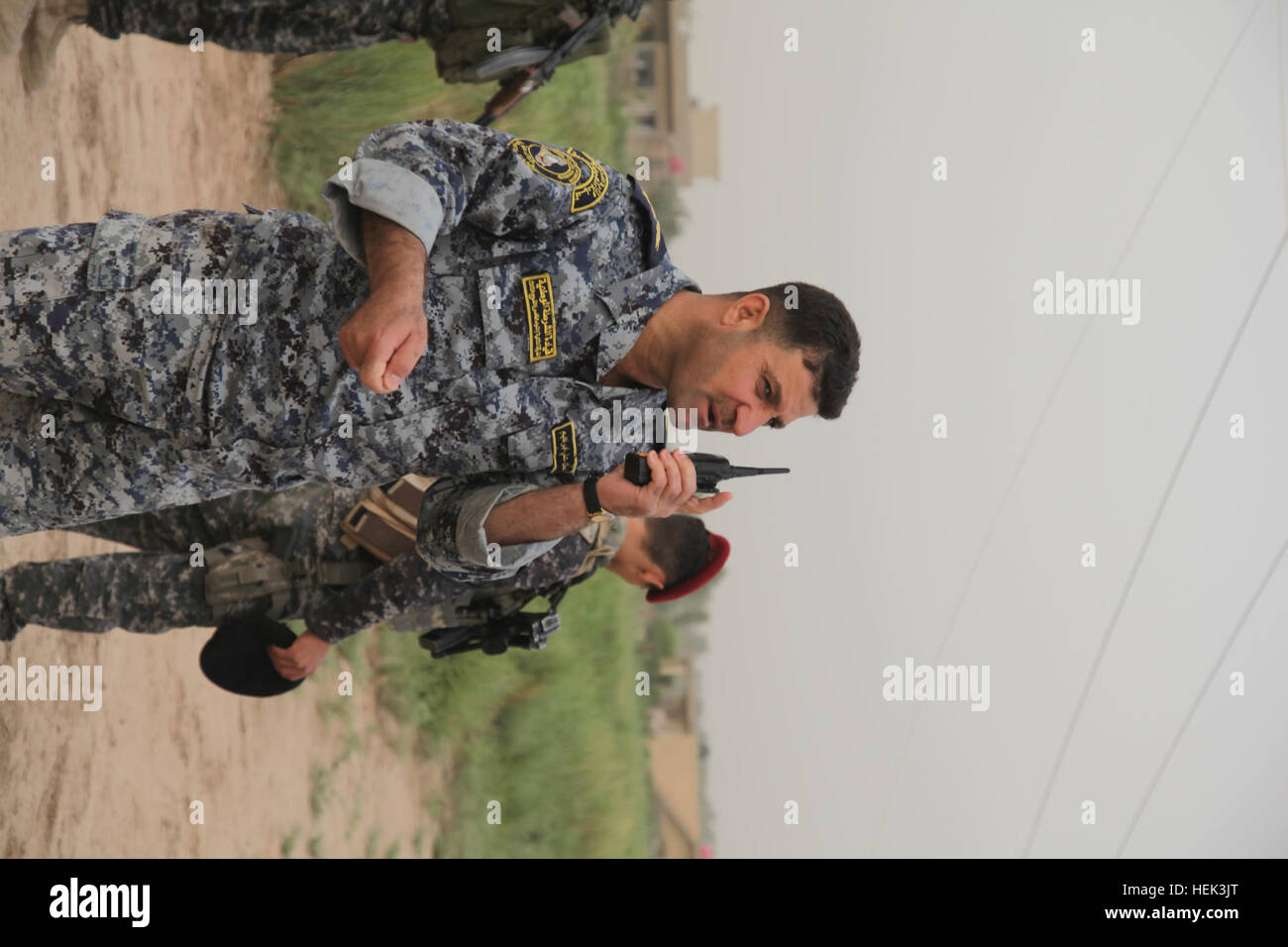 Iraqi Security Forces Gen. Hassan directs his troops during a search and cordon in Makasib, Iraq, May 29. ISF searched the area to seize government weapons from former Sons of Iraq members. Search and cordon 289716 Stock Photo