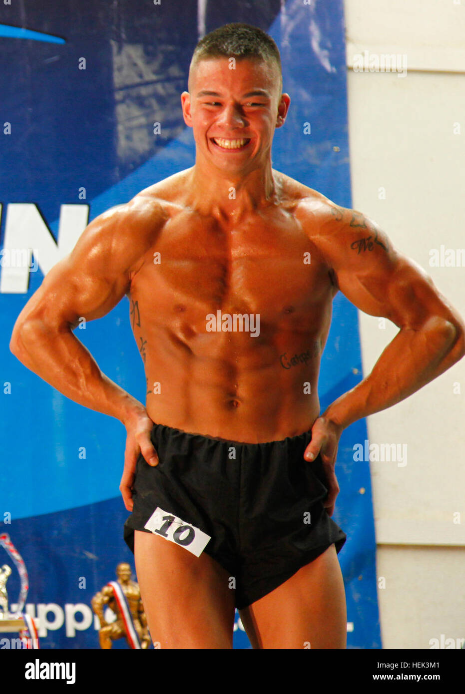 U.S. Army Spc. Justin Lu from the 204th Area Support Medical Company, poses during a body building competition on Contingency Operation Base Basra, Iraq, May 29. A total of 29 U.S. service men and women participated in the competition. Body Building Competition 288751 Stock Photo
