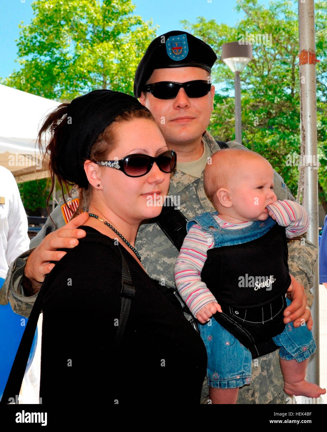 Oregon National Guard Spc. Aaron Wolf, wife Lacie and his family of Portland attended the Yellow Ribbon Career and Benefits Fair at Clackamas Community College June 26. The event was to help the 41st Infantry Brigade Combat Team Soldiers with reintegration after returning from deployment in Iraq. Wolf returned home with no job. While at the event Wolf was approached by a vendor and was given an interview for a job in the new field of solar energy. Wolf has four children from are four months to 11 years old. Yellow Ribbon Event 294580 Stock Photo