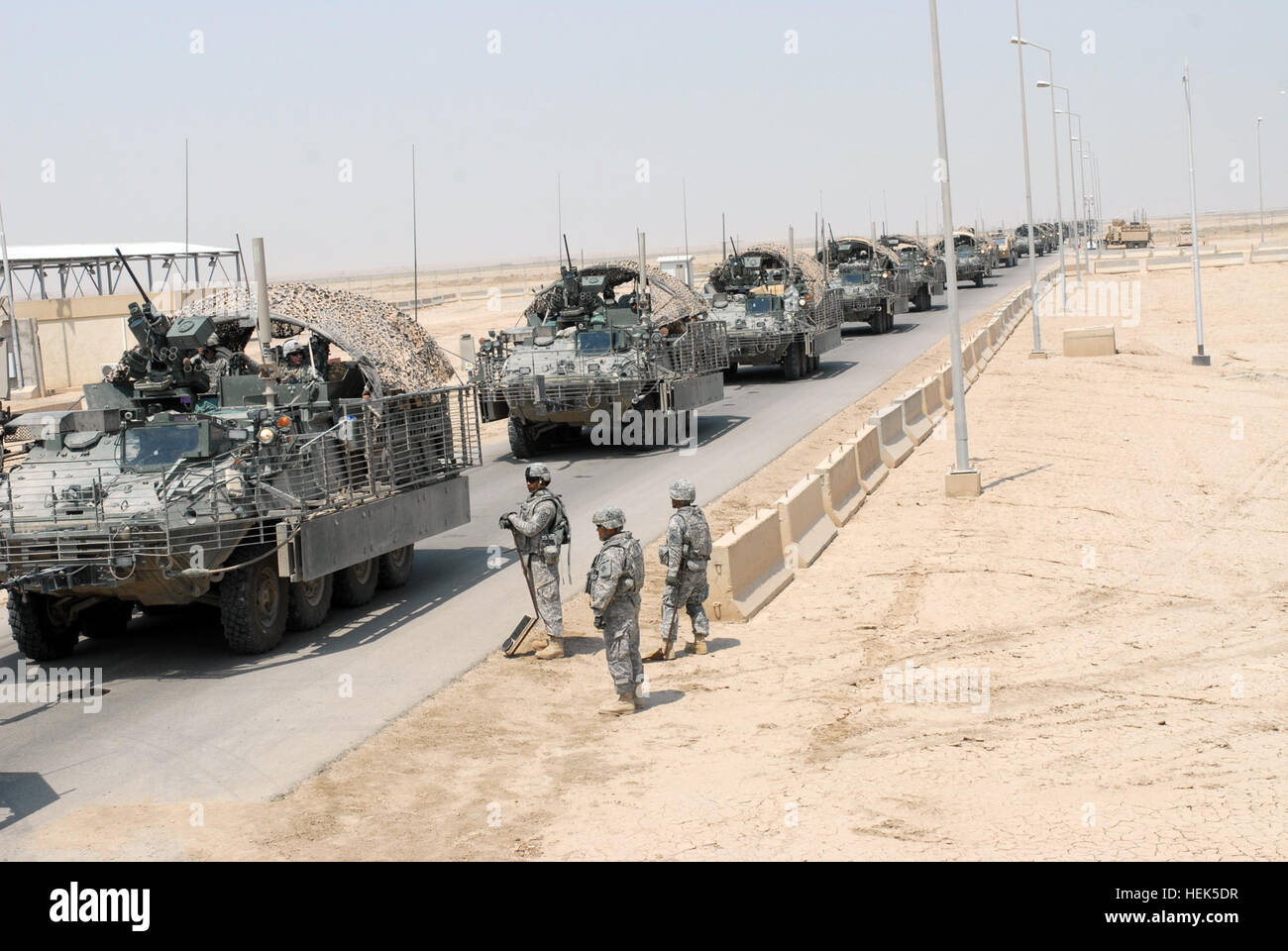 A 4th Stryker Brigade Combat Team, 2nd Infantry Division, vehicle convoy approaches the clearing barrels at an entry  point at Contingency Operating Base Adder, Aug. 18. The Stryker Brigade made a stop at COB Adder to refuel and rest during their convoy from Baghdad to Kuwait. The Stryker Brigade is the last combat unit to leave Iraq before the transition from Operation Iraqi Freedom to Operation New Dawn. (Photo by Pfc. Khori Johnson) Convoy from Baghdad to Kuwait 310958 Stock Photo