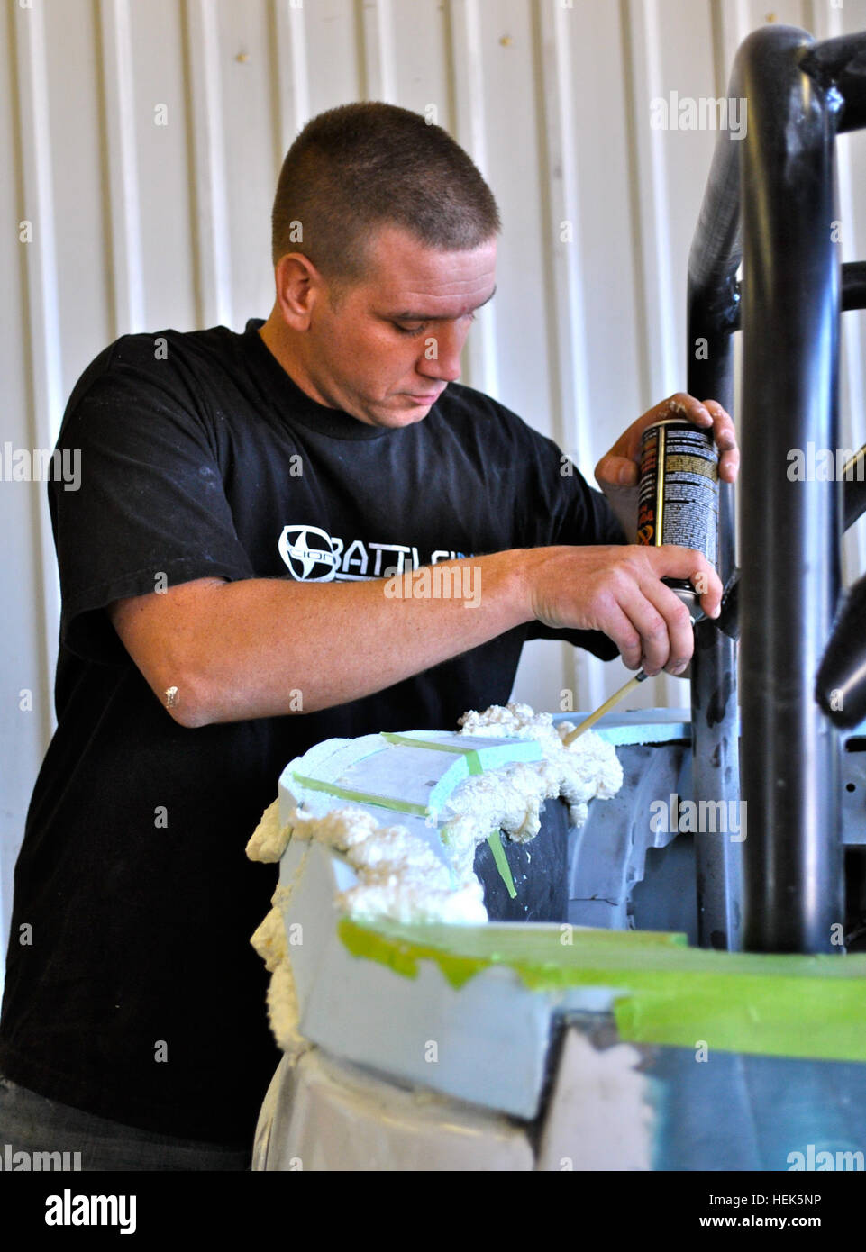 Pfc. Nathaniel Machowski, a native of Denver, Colo. and a combat engineer assigned to the 55th Mobility Augmentation Company, 4th Maneuver Enhancement Brigade on Fort Leonard Wood, Mo., builds a foam mold in preparation of fiberglass on a Scion xB. Machowski is part of Team Sapper, one of three finalists in the Toyota - Battle of the Builds 2010, a competition in which each team will design a custom vehicle using the Scion xB and $15,000. Five Combat Engineers, One Scion XB and $15,000 Equal Winning Team 316709 Stock Photo
