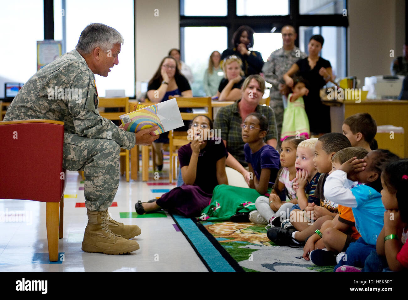 Chief of Staff of the U.S. Army Gen. George W. Casey reads a Dr. Seuss book to children at the newly-constructed children's portion of the Casey Memorial Library on Fort Hood, Texas, Sept. 8, 2010. (DoD photo by D. Myles Cullen, U.S. Army/Released) 100908-A-0193C-006 (4974530178) Stock Photo