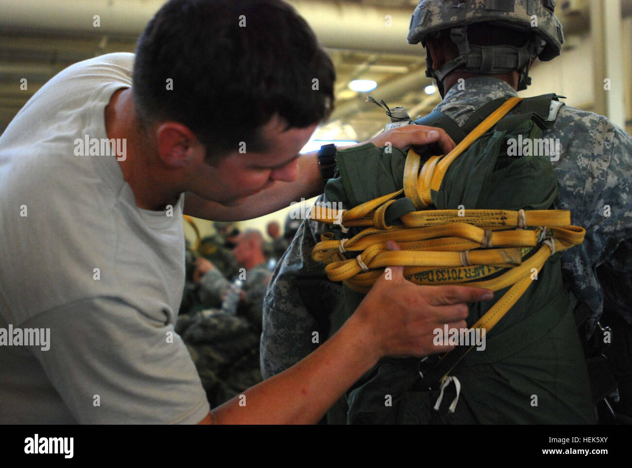 A 2nd Brigade Combat Team Jumpmaster insects a Paratrooper's static