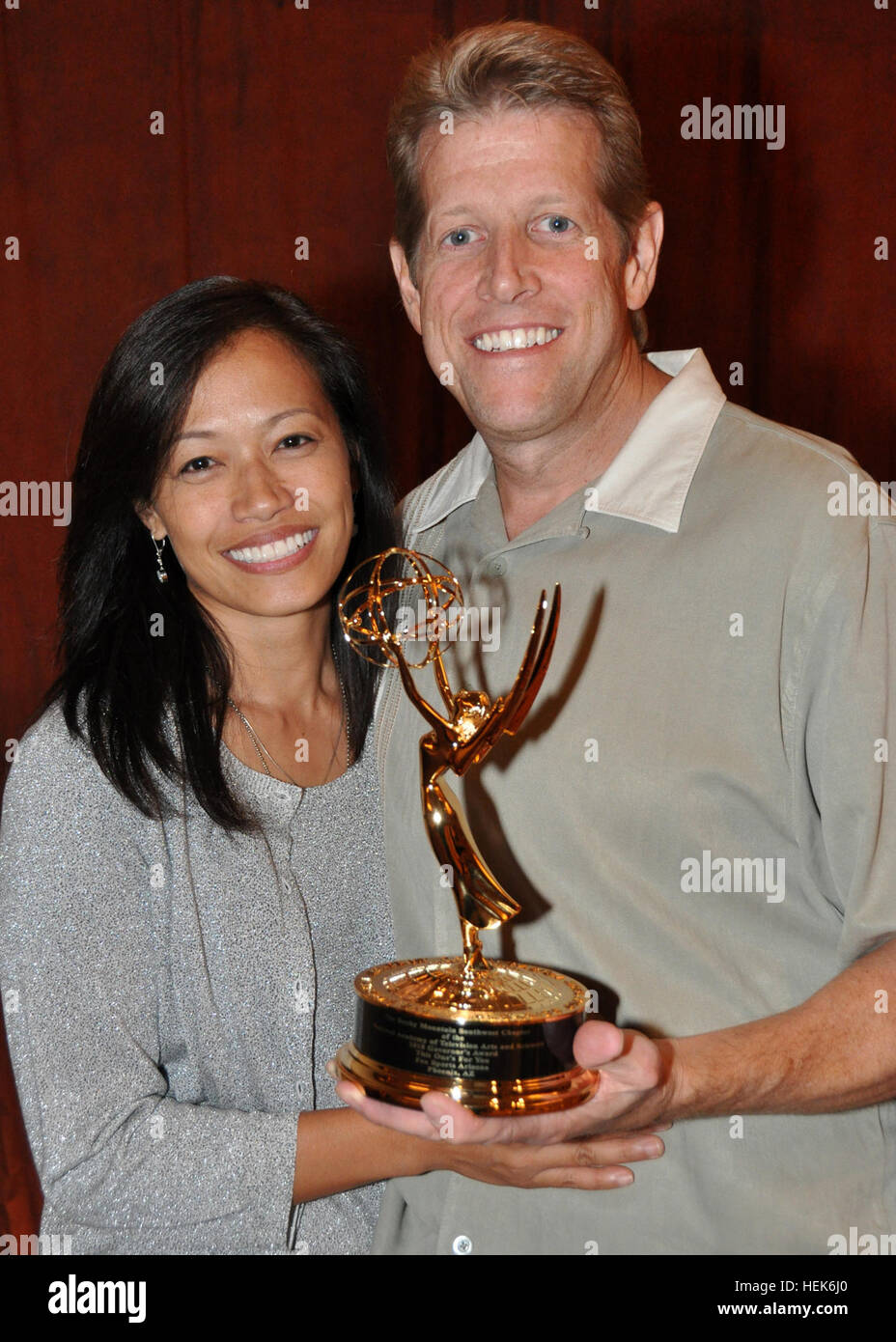 Gold Star parents Maria and David Miller hold the Emmy awarded to Fox Sports Arizona for 'This One's For You!' at the 33rd Annual Rocky Mountain Emmy Awards at the Sheraton Downtown Phoenix, Oct. 9. The Millers have been part of the 'This One's For You!' telecasts since 2008. Their son, Mykel, was a combat casualty while a member of the Ariziona Army National Guard during a deployment to Afghanistan in 2007. Arizona National Guard Stars in Emmy-winning Fox Sports Broadcast 328042 Stock Photo