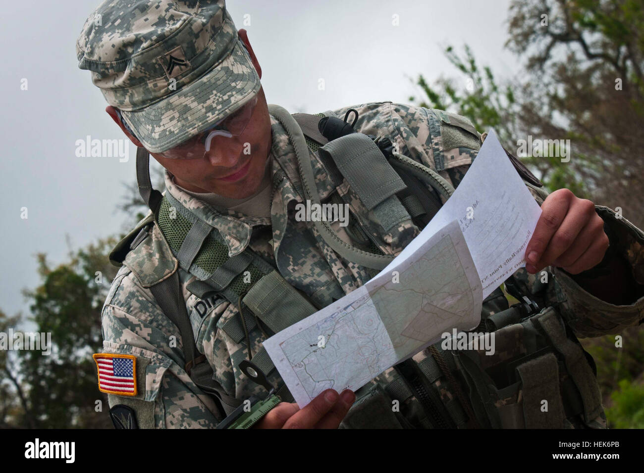 Spc. Jorge Diaz, 402nd Civil Affairs Bn., checks his map during the land navigation portion of the 350th Civil Affairs Command best warrior competition at Camp Bullis, Texas on March 24, 2012. (U.S. Army photo by Staff Sgt. Felix R. Fimbres) 350th CACOM battles it out by the Alamo 120324-A-CK868-979 Stock Photo