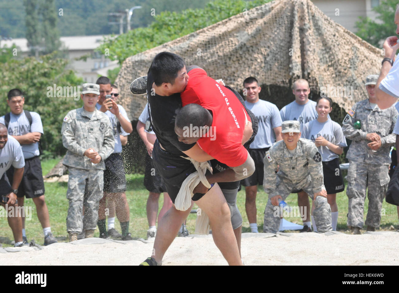 Soldiers from 210th Field Artillery Brigade participate in Ssireum, a Korean form of wrestling on Camp Casey, South Korea, July 1, 2014. Ssireum is just one of the many sporting events included in Warrior Friendship Week; others include basketball, soccer, and tug of war. Warrior Friendship Week day two 140701-A-IV618-196 Stock Photo