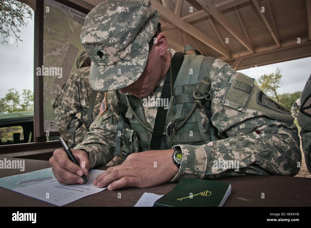 Spc. Jorge L.  Diaz, 402nd Civil Affairs Battalion, plots his points during the land navigation portion of the 350th Civil Affairs Command Best Warrior Competition at Camp Bullis, Texas on March 24, 2012. Diaz is from Vega Baja, Puerto Rico and is an information technician with the 402nd in Fort Buchanan, Puerto Rico. (U.S. Army photo by Staff Sgt. Felix R. Fimbres) 350th CACOM battles it out by the Alamo 120324-A-CK868-960 Stock Photo