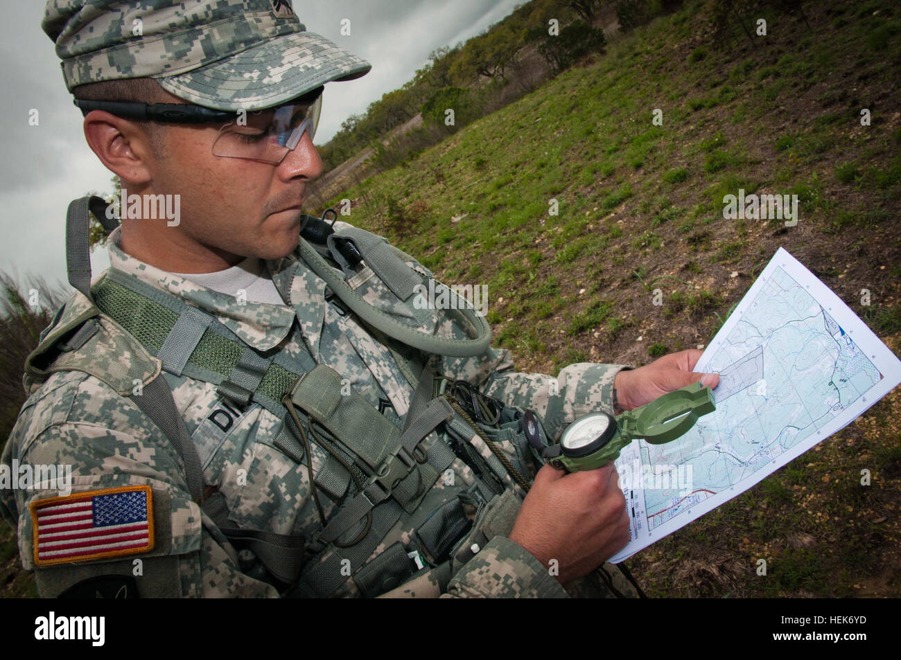 Cpl. John Diaz, 410th Civil Affairs Battalion, checks his map during the land navigation portion of the 350th Civil Affairs Command Best Warrior Competition at Camp Bullis, Texas on March 24, 2012. Diaz is from El Paso, Texas and is a civil affairs team sergeant with the 410th, which is also based in El Paso. (U.S. Army photo by Staff Sgt. Felix R. Fimbres) 350th CACOM battles it out by the Alamo 120325-A-CK868-283 Stock Photo