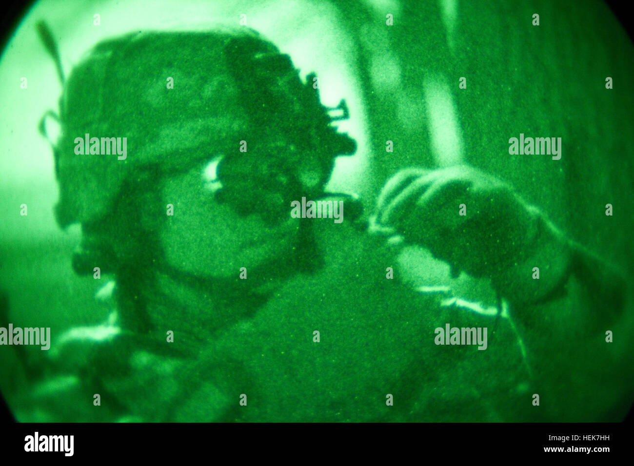U.S. Army 2nd Lt. George Kane, an infantry officer, 1-506 HHC Mortars, 4th Brigade, 101st Airborne Division, a resident of Seattle, Wash., looks through his monocular night vision optic toward his objective during Operation Gazme Shab 3 Nov. 18, 2010. The purpose for the operation is to assess local activity in the evening hours and gather intel for future operations.  (Photo by: Cpl. Kevin Martin) Gazme Shab 3 342124 Stock Photo