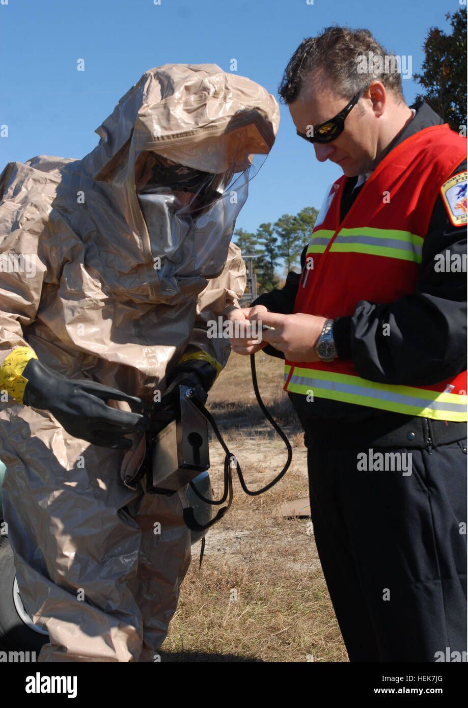Hazardous material technicians are inspected after analyzing deadly