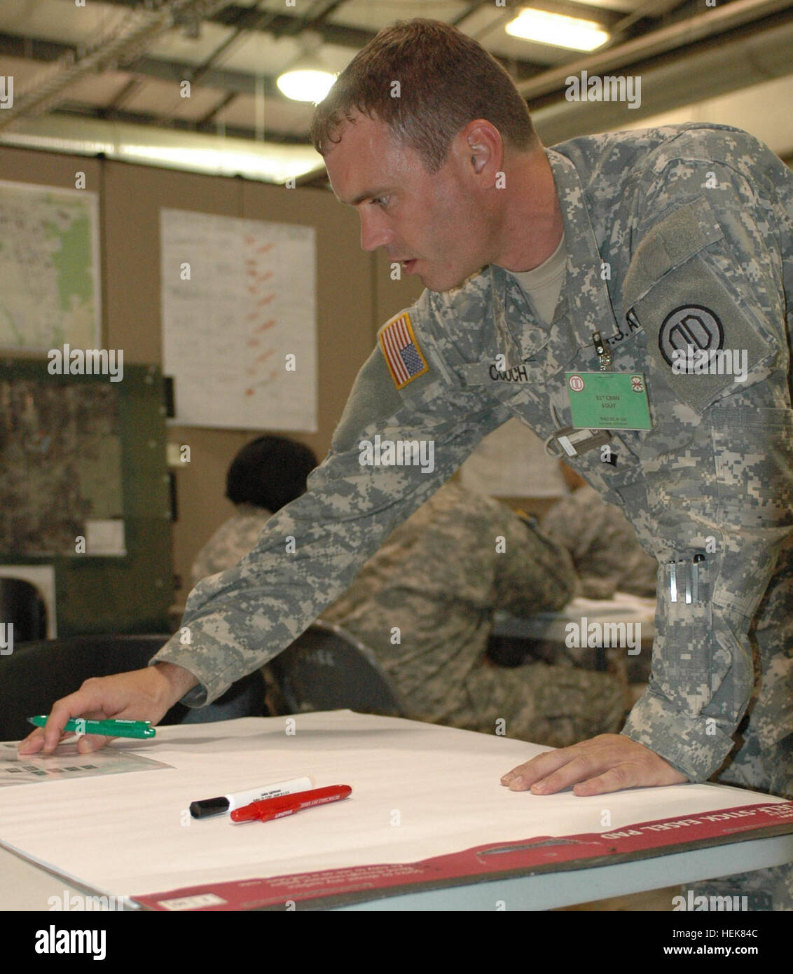 Spc. Kevin Couch, a combat medic of the Brigade Surgeon cell, HHD 31st  Chemical Brigade, prepares a chart to display medical information during  the Vibrant Response 13 exercise around the beginning of