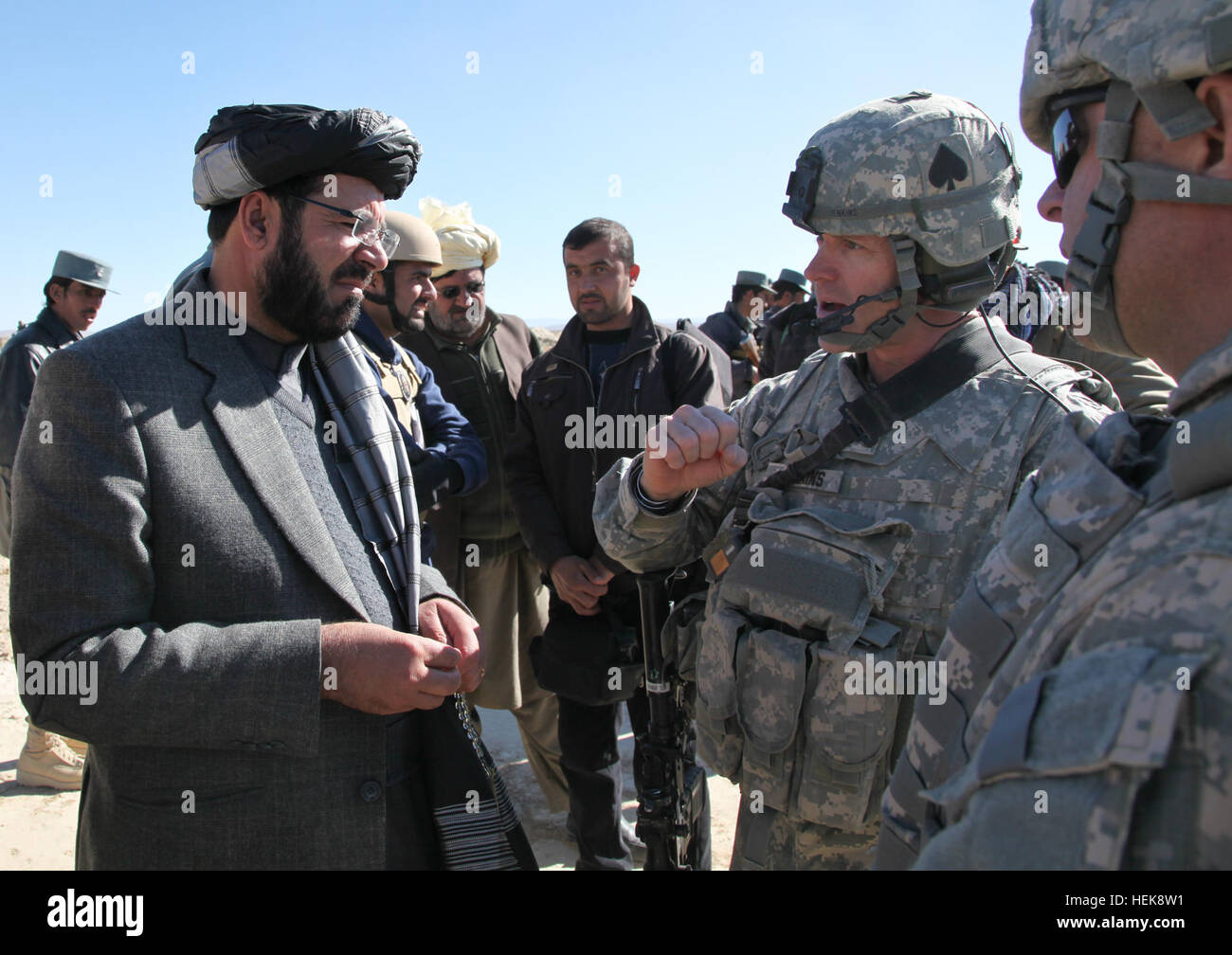 U.S. Army Col. Sean Jenkins, Task Force Currahee, 4th Brigade Combat Team, 101st Airborne Division Commander speaks with National Director of Security for Paktika Col. Satar Khan and Paktika Gov. Moheebulah Samim during a meeting held at the Afghan Uniformed Police Officers Compound near Forward Operating Base Kushamond, Paktika province, Afghanistan, Jan. 27, 2011. The meeting was held to discuss the loss of twenty innocent civilians killed earlier in the week by an improvised explosive device. Key Leader engagement with Paktika Gov. Moheebullah Samim. 364074 Stock Photo