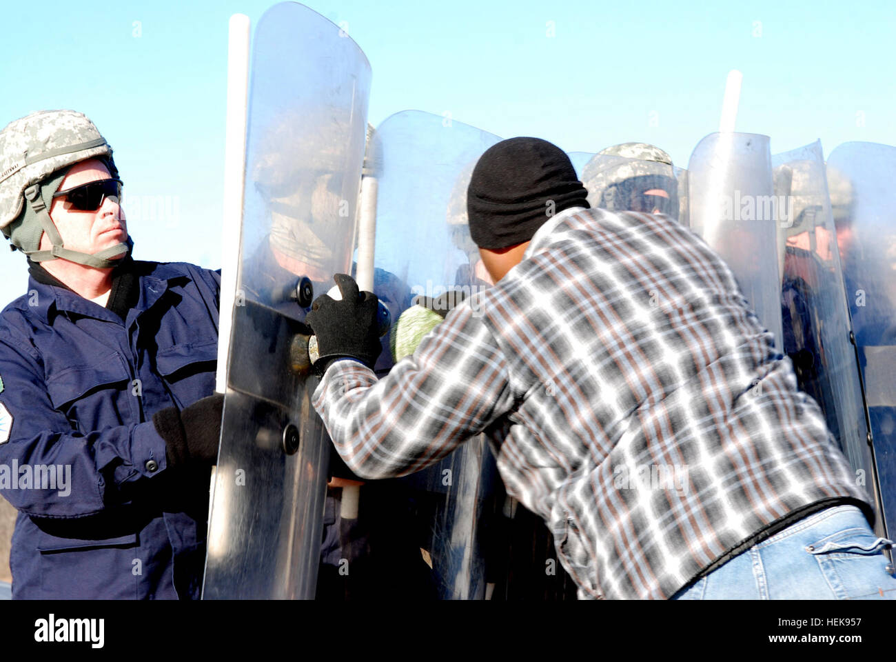 U.S. Army soldiers, playing Kosovo police, repel a rioter during an ...