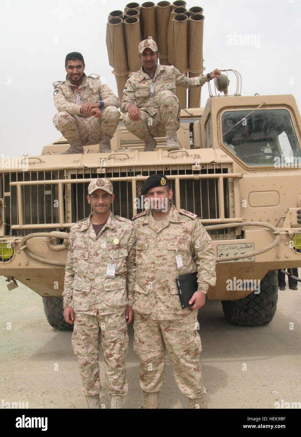 Kuwaiti army Capt. Adel Khubert, lower left, was just a 10-year-old boy when Saddam Hussein's Republic Guard invaded Kuwait. Today, he and his fellow soldiers are celebrating the 20th anniversary of their country's liberation during Operation Desert Storm, Feb. 26. Kuwaiti BM-30 Smerch Stock Photo