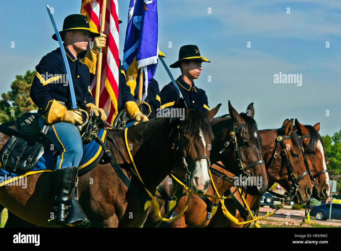 Fort Carsonâ€™s mounted color guard stands alongside soldiers from the 440th Civil Affairs Bn. at Fort Carson, Colo., Sept. 15, 2012. Flickr - The U.S. Army - Horse Soldiers Stock Photo